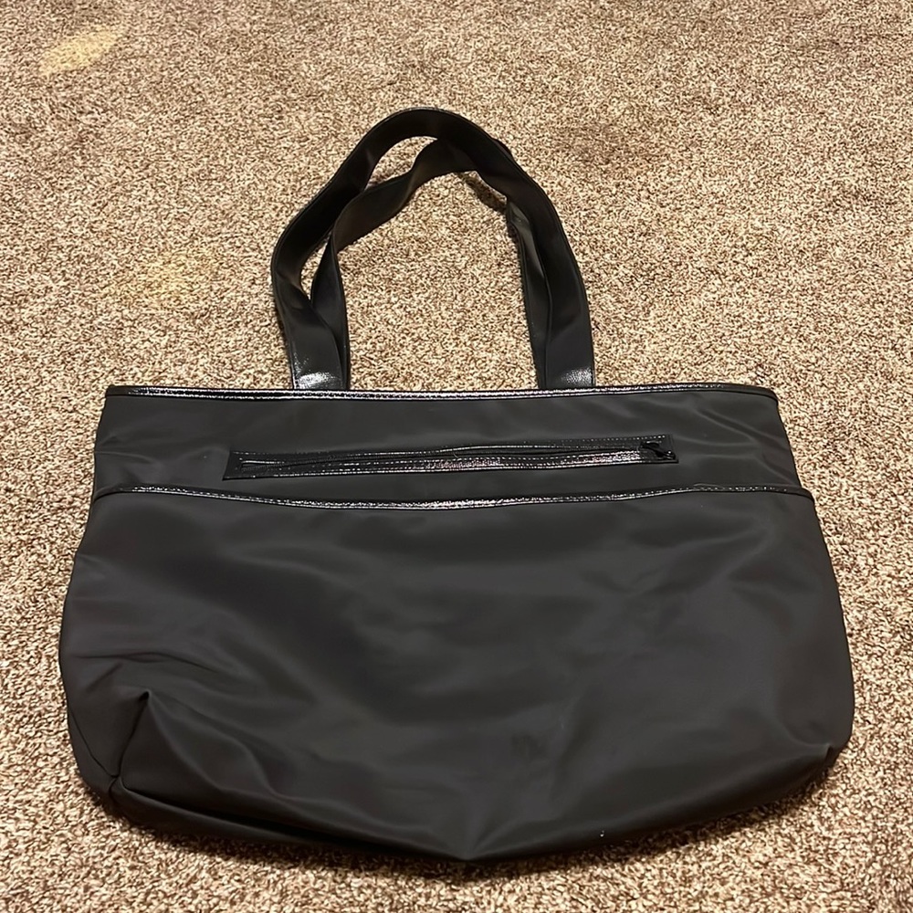 Black tote bag. Immaculate! Lots of pockets. Waterproof inside.